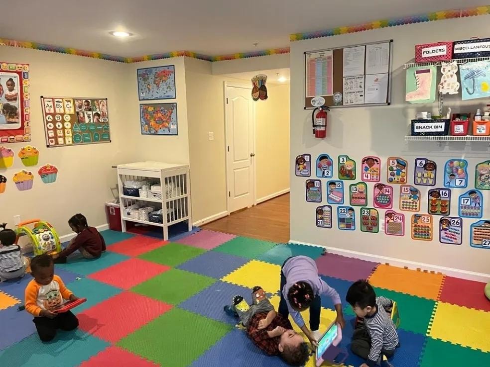 Children playing in a colorful classroom activity area